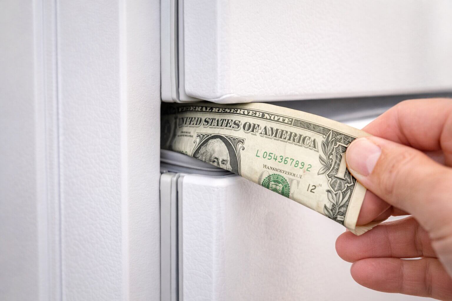 Performing the dollar bill test on a magnetic refrigerator door gasket seal